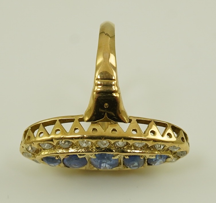 A late Victorian 18ct gold sapphire and diamond set oval cluster ring